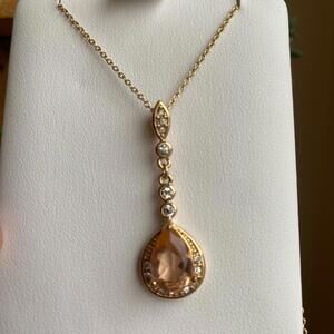Elegant Gold Tone Necklace with Teardrop Pendant and Clear Stones
